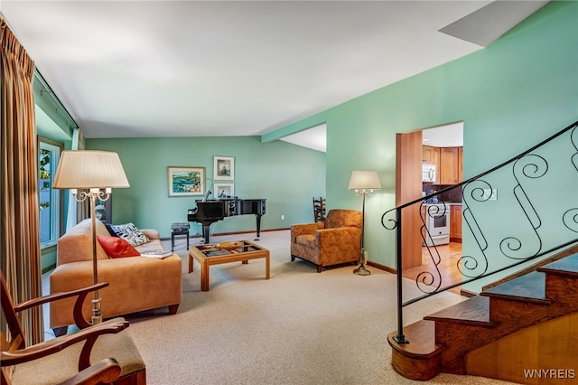 172 Shetland Dr, Amherst, NY 14221 - carpeted living room with stairs and vaulted ceiling