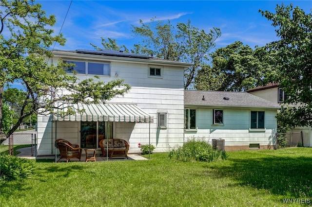 172 Shetland Dr, Amherst, NY 14221 - back of property featuring roof mounted solar panels, an outdoor living space, a patio area, and a shingled roof