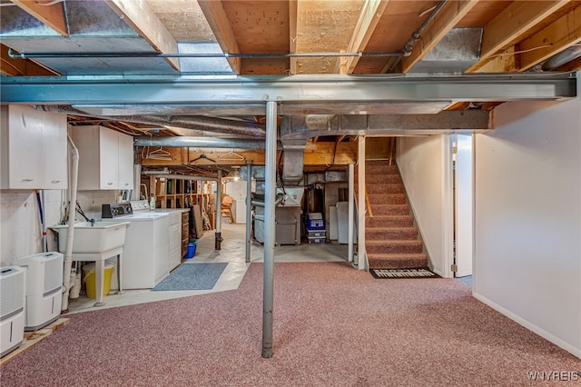 172 Shetland Dr, Amherst, NY 14221 - unfinished below grade area featuring washer and clothes dryer, light carpet, stairs, and heating unit