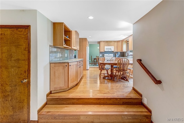 172 Shetland Dr, Amherst, NY 14221 - kitchen featuring light wood finished floors, white microwave, open shelves, backsplash, and recessed lighting