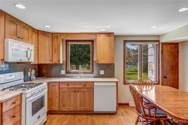 172 Shetland Dr, Amherst, NY 14221 - kitchen with white appliances, tasteful backsplash, light wood-style flooring, light stone counters, and recessed lighting