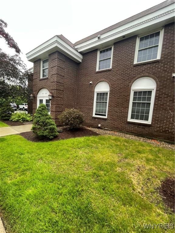 138 Charter Oaks Dr Unit B, Amherst, NY 14228 - view of front of home with brick siding and a front yard