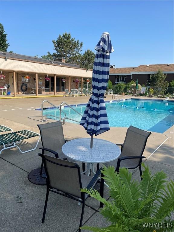 138 Charter Oaks Dr Unit B, Amherst, NY 14228 - community pool featuring a patio area