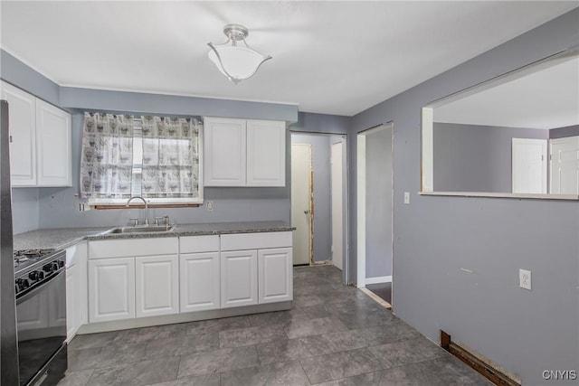 711 Mountainview Ave, Syracuse, NY 13224 - kitchen featuring gas range oven and white cabinets