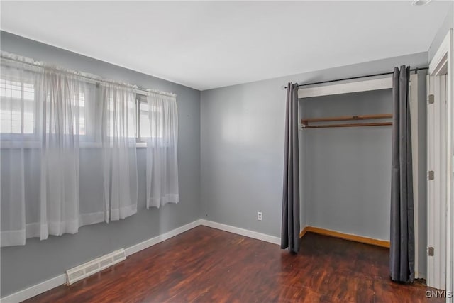 711 Mountainview Ave, Syracuse, NY 13224 - unfurnished bedroom with a closet and wood finished floors