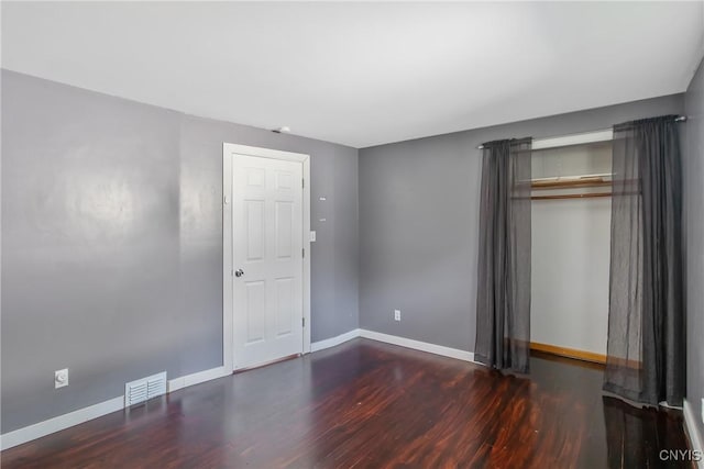 711 Mountainview Ave, Syracuse, NY 13224 - unfurnished bedroom with wood finished floors and a closet