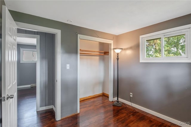 711 Mountainview Ave, Syracuse, NY 13224 - unfurnished bedroom with a closet and dark wood-type flooring