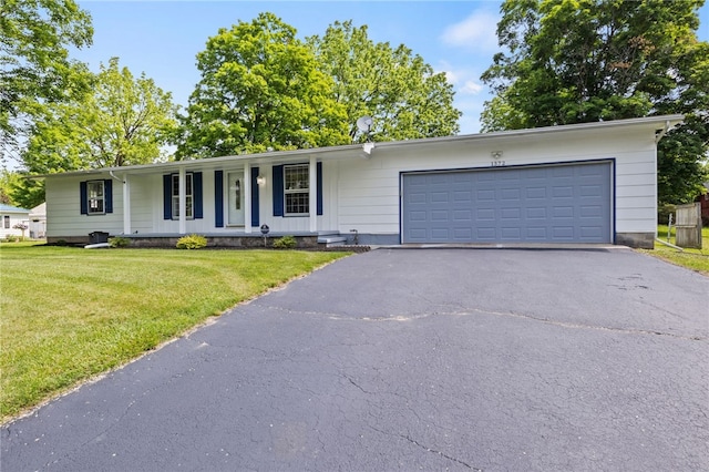 1372 Canandaigua Rd, Macedon, NY 14502 - ranch-style home featuring asphalt driveway, a front lawn, a porch, and an attached garage