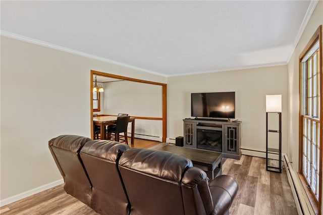 1372 Canandaigua Rd, Macedon, NY 14502 - living room with a baseboard radiator, ornamental molding, a baseboard heating unit, and wood finished floors