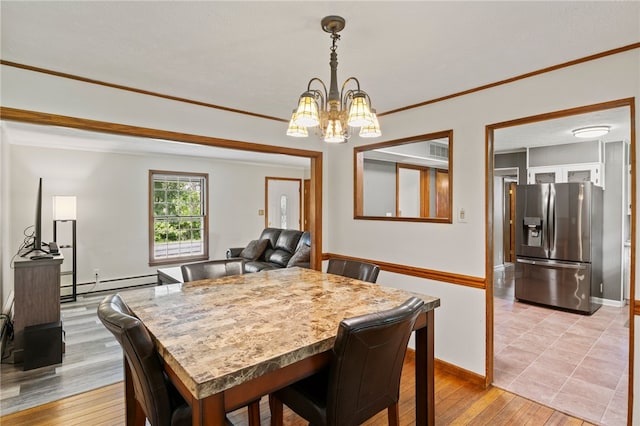 1372 Canandaigua Rd, Macedon, NY 14502 - dining space with baseboard heating, a chandelier, light wood-style floors, and crown molding