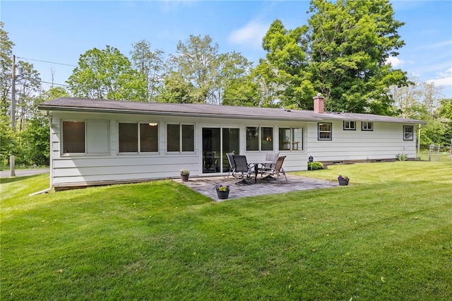 1372 Canandaigua Rd, Macedon, NY 14502 - rear view of house featuring a patio, a chimney, and a yard
