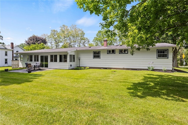 1372 Canandaigua Rd, Macedon, NY 14502 - rear view of house featuring a yard, a patio, and a chimney