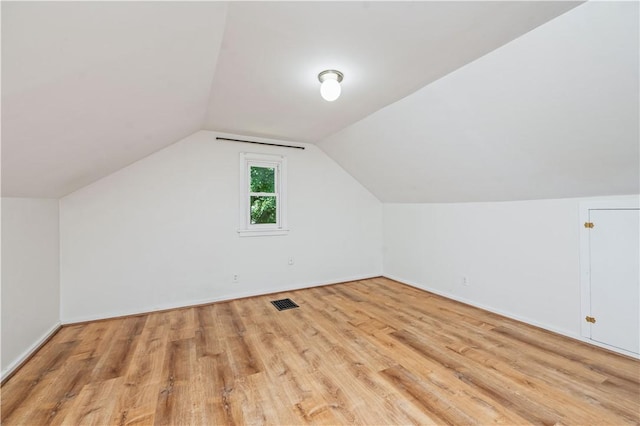 225 Dorking Rd, Brighton, NY 14610 - additional living space with light wood-style flooring and lofted ceiling
