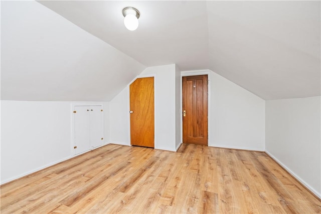 225 Dorking Rd, Brighton, NY 14610 - additional living space with light wood-type flooring and vaulted ceiling