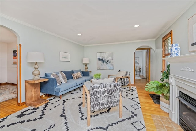 225 Dorking Rd, Brighton, NY 14610 - living area featuring arched walkways, wood finished floors, crown molding, recessed lighting, and a glass covered fireplace