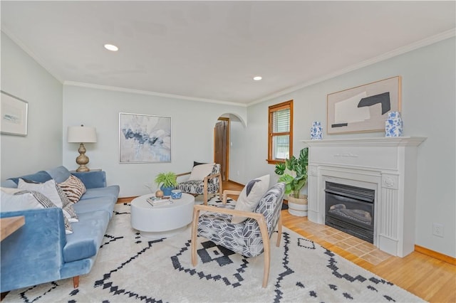225 Dorking Rd, Brighton, NY 14610 - living area featuring arched walkways, wood finished floors, crown molding, recessed lighting, and a fireplace with flush hearth