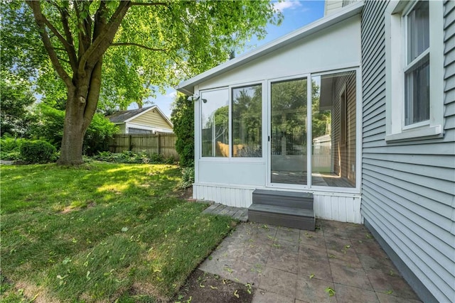 225 Dorking Rd, Brighton, NY 14610 - view of property exterior with a sunroom and a patio