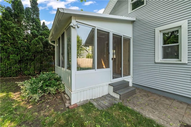225 Dorking Rd, Brighton, NY 14610 - view of property exterior featuring a sunroom and entry steps