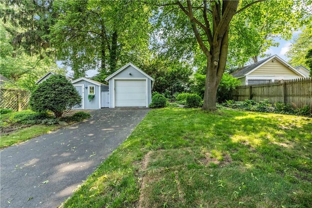 225 Dorking Rd, Brighton, NY 14610 - view of yard featuring an outbuilding, driveway, and a detached garage