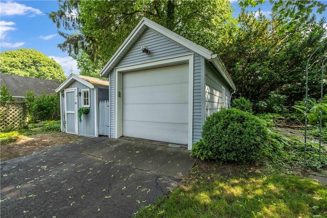 225 Dorking Rd, Brighton, NY 14610 - detached garage featuring concrete driveway