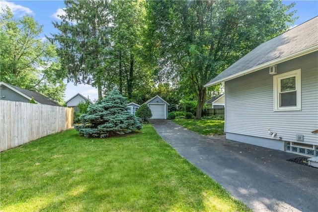 225 Dorking Rd, Brighton, NY 14610 - view of yard with driveway, a garage, and an outbuilding