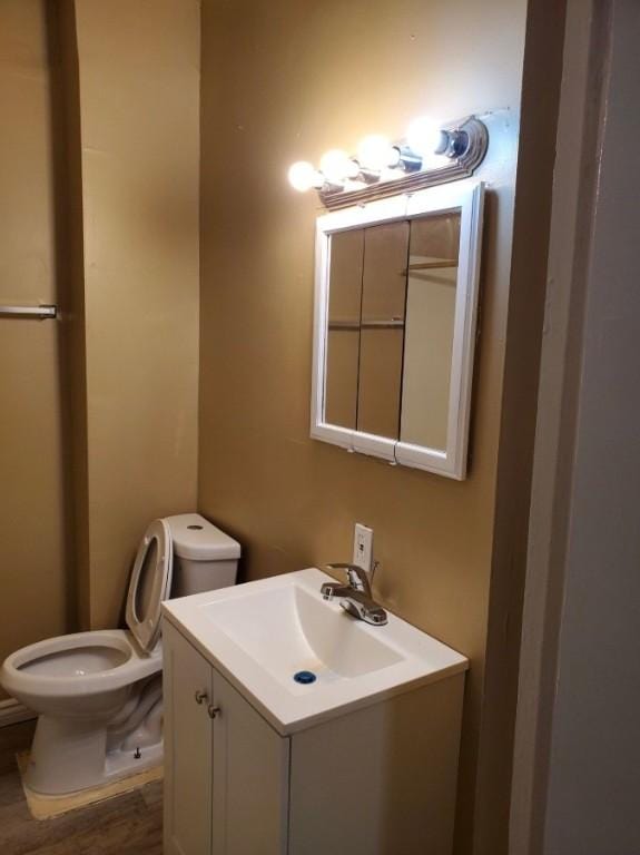 22 Sullivan St, Rochester, NY 14605 - half bathroom with vanity and wood finished floors