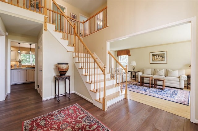 100 Broadmoor Trl, Perinton, NY 14450 - stairs with wood finished floors and a towering ceiling