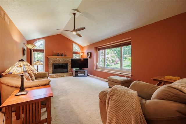 100 Broadmoor Trl, Perinton, NY 14450 - living area featuring ceiling fan, light carpet, plenty of natural light, vaulted ceiling, and a brick fireplace