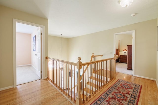 100 Broadmoor Trl, Perinton, NY 14450 - corridor with an upstairs landing and light wood-style flooring