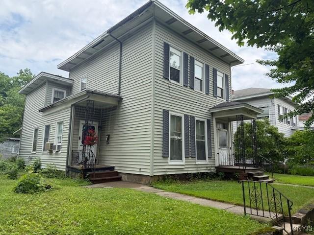 213 N Madison St, Rome-Inside, NY 13440 - view of front of property with a front lawn and cooling unit
