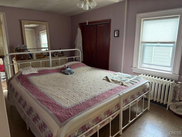 213 N Madison St, Rome-Inside, NY 13440 - bedroom with radiator heating unit