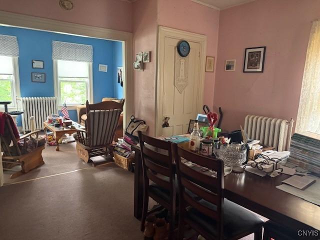 213 N Madison St, Rome-Inside, NY 13440 - dining space featuring radiator heating unit