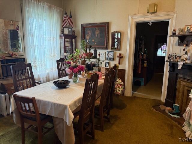 213 N Madison St, Rome-Inside, NY 13440 - dining area featuring carpet floors