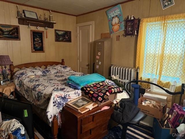 213 N Madison St, Rome-Inside, NY 13440 - bedroom featuring crown molding and wooden walls