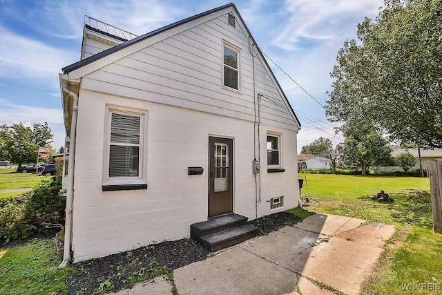 331 S Shore Blvd, Lackawanna, NY 14218 - rear view of house with entry steps and a lawn