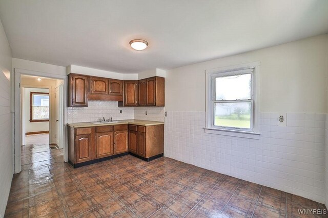 331 S Shore Blvd, Lackawanna, NY 14218 - kitchen featuring tile walls, light countertops, and wainscoting
