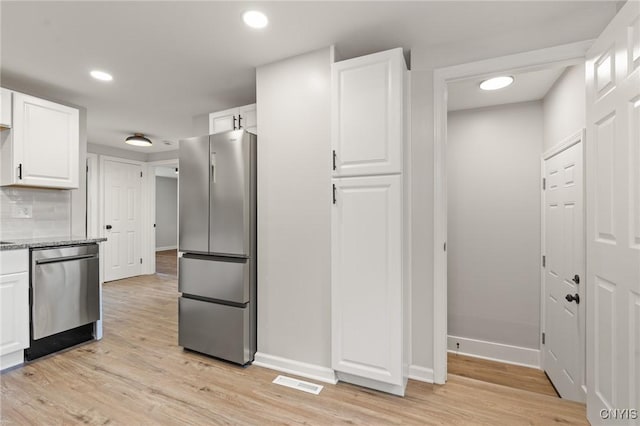 331 Darlington Rd, Syracuse, NY 13208 - kitchen featuring stainless steel appliances, white cabinetry, light wood-style floors, decorative backsplash, and recessed lighting