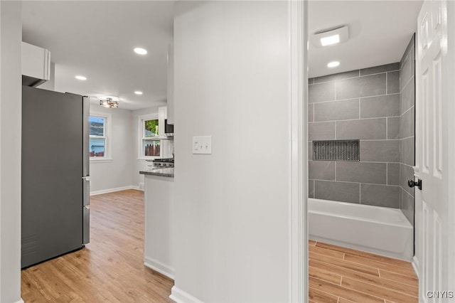 331 Darlington Rd, Syracuse, NY 13208 - full bathroom with wood finished floors, recessed lighting, and tub / shower combination