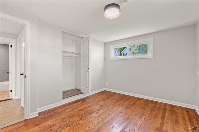 331 Darlington Rd, Syracuse, NY 13208 - unfurnished bedroom featuring wood finished floors and a closet