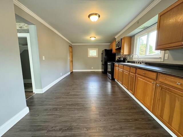 207 Morrow St, Elmira-City, NY 14904 - kitchen featuring black electric range oven, crown molding, dark countertops, brown cabinetry, and healthy amount of natural light