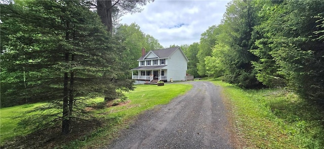 527 Harper Rd, Harpersfield, NY 13786 - view of front of house featuring driveway, a chimney, a forest view, and a porch