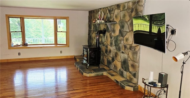 527 Harper Rd, Harpersfield, NY 13786 - living room featuring wood finished floors and a wood stove