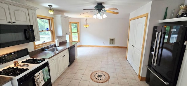527 Harper Rd, Harpersfield, NY 13786 - kitchen with black appliances, ceiling fan, light tile patterned flooring, dark countertops, and hanging light fixtures