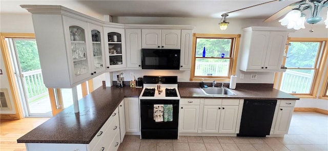 527 Harper Rd, Harpersfield, NY 13786 - kitchen with black appliances, dark countertops, white cabinets, and healthy amount of natural light