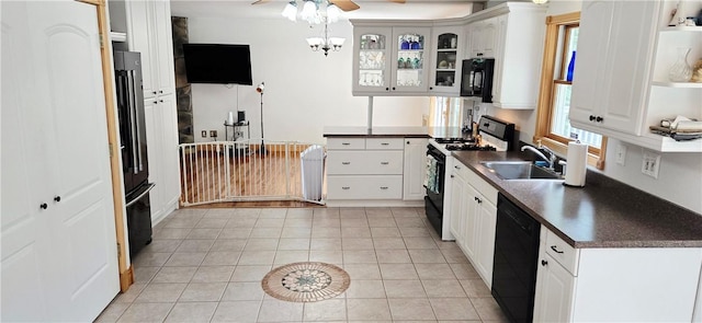 527 Harper Rd, Harpersfield, NY 13786 - kitchen featuring black appliances, dark countertops, a ceiling fan, glass insert cabinets, and white cabinets