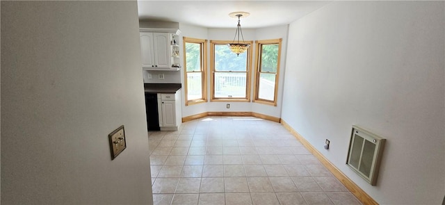 527 Harper Rd, Harpersfield, NY 13786 - unfurnished dining area with light tile patterned floors and a chandelier