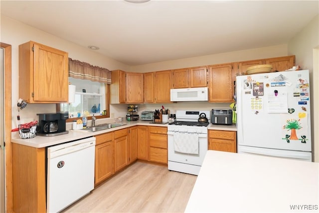 7727 Dewitt Rd, Pike, NY 14024 - kitchen with white appliances, light countertops, and light wood finished floors