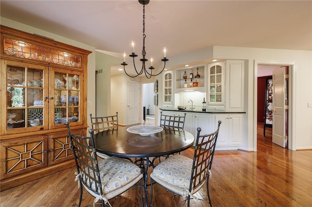 7974 Oak Brook Cir, Pittsford, NY 14534 - dining room with light wood-type flooring, a chandelier, and recessed lighting