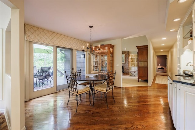 7974 Oak Brook Cir, Pittsford, NY 14534 - dining area with wood finished floors, a chandelier, and recessed lighting