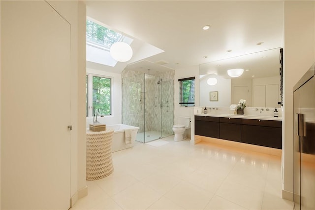 7974 Oak Brook Cir, Pittsford, NY 14534 - full bathroom with a shower stall, double vanity, a freestanding bath, a skylight, and tile patterned flooring